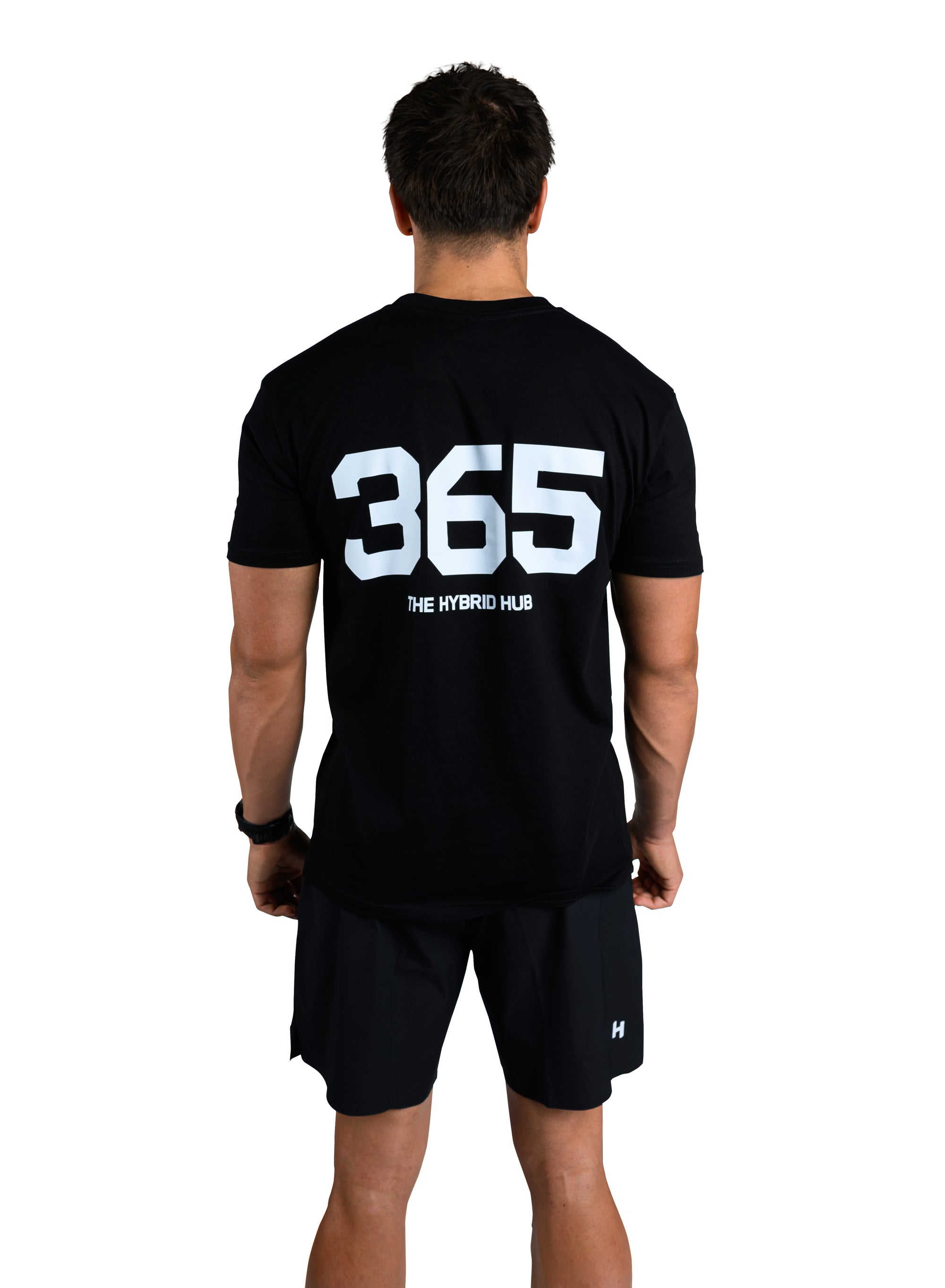Person wearing a black t-shirt with '365' printed on the back, standing against a white background.