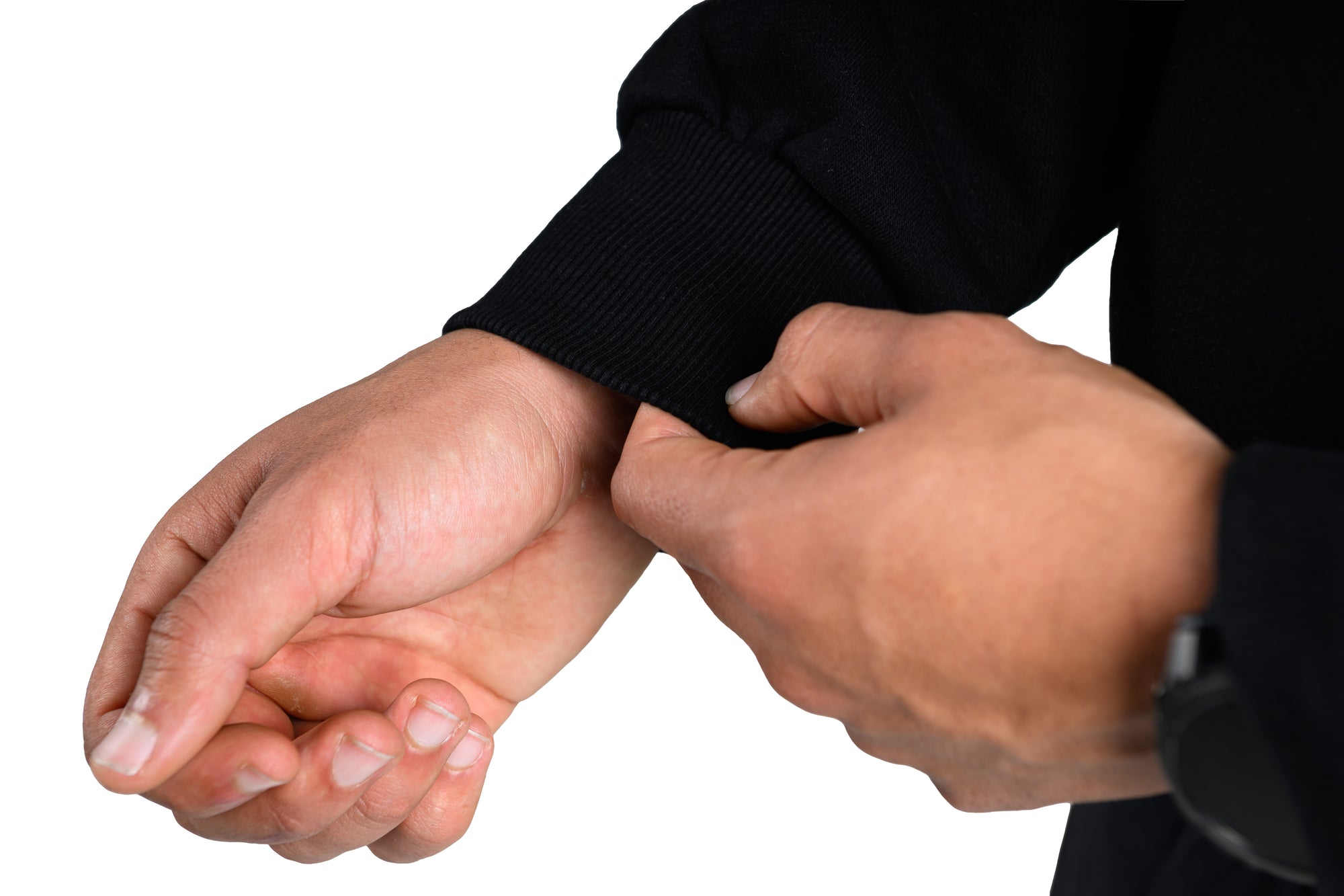 Person adjusting a black sleeve on their arm against a white background