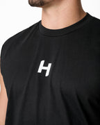 Black sleeveless shirt with a white logo on a plain background