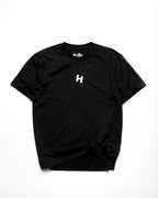 Black t-shirt with a white 'H' logo on a white background