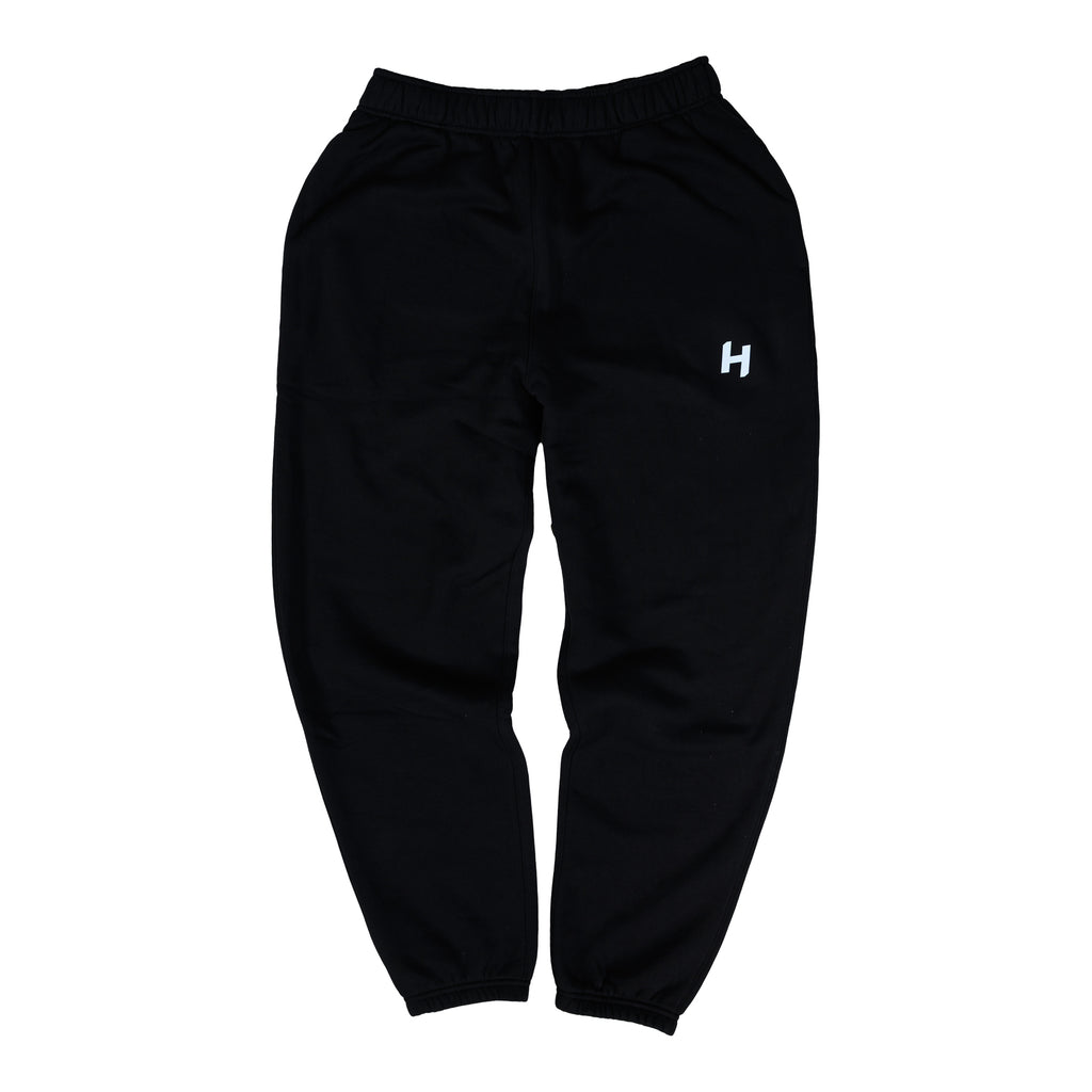 Black sweatpants with a white logo on a white background