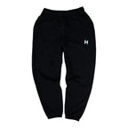 Black sweatpants with a white logo on a white background