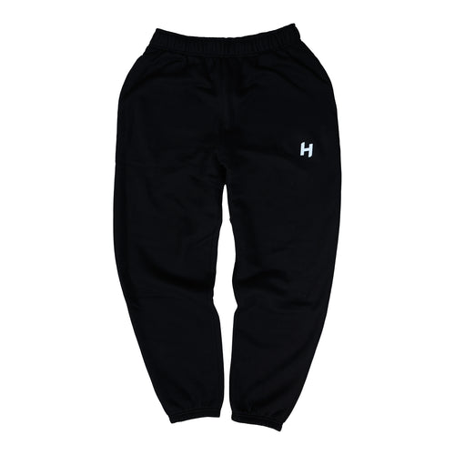 Black sweatpants with a white logo on a white background
